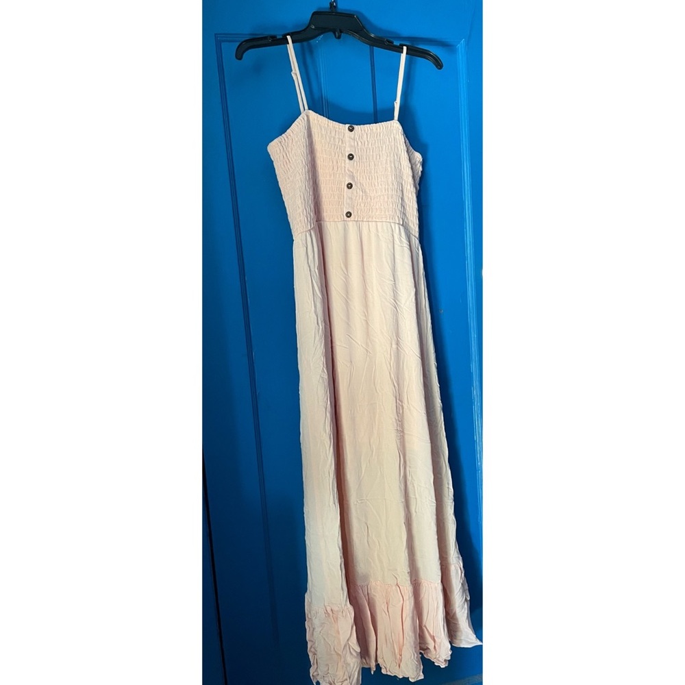 Long pastel pink dress with buttons at the front with ruched detail at the top!